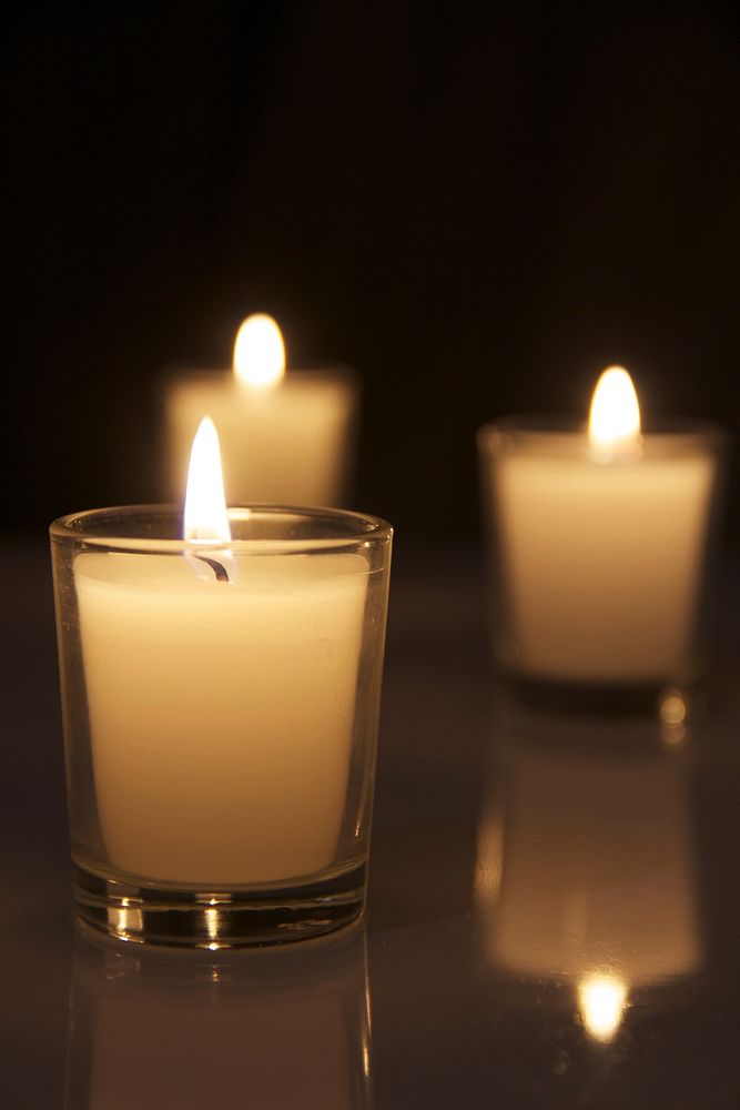 Free candle lights fire in dark background photo, public domain CC0 image.