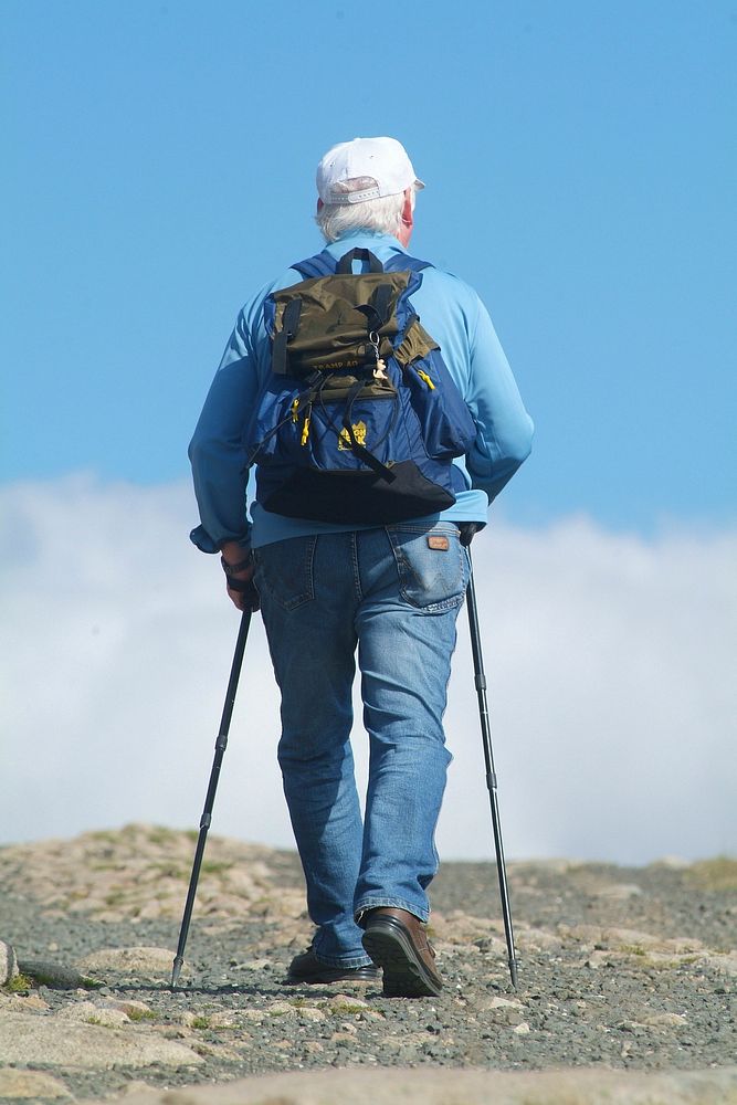 Free man hiking on mountain photo, public domain nature CC0 image.