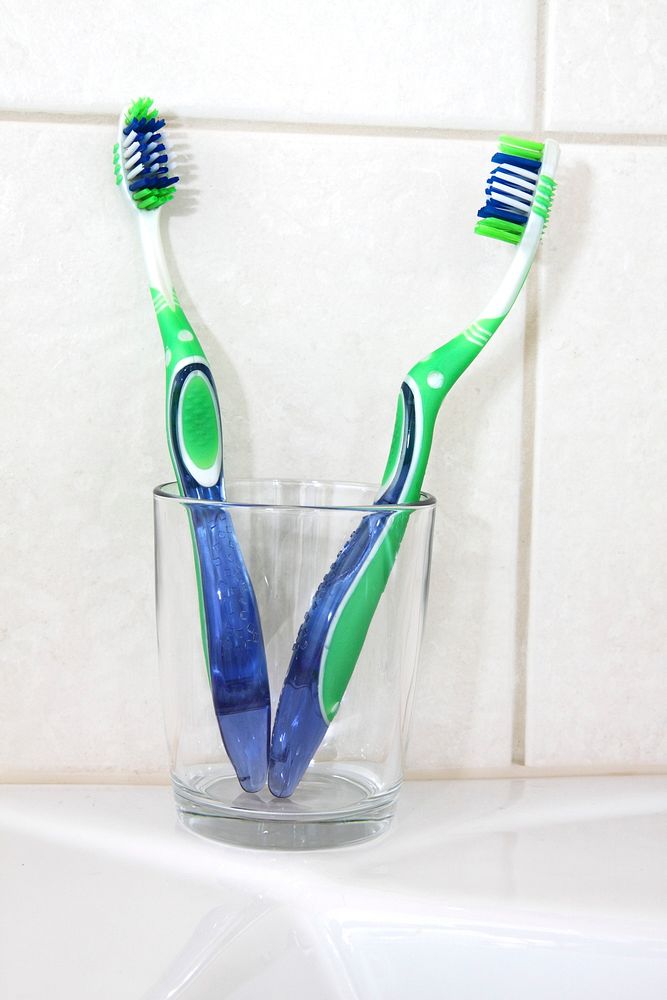 Free two toothbrushes at a couple's bathroom image, public domain CC0 photo.