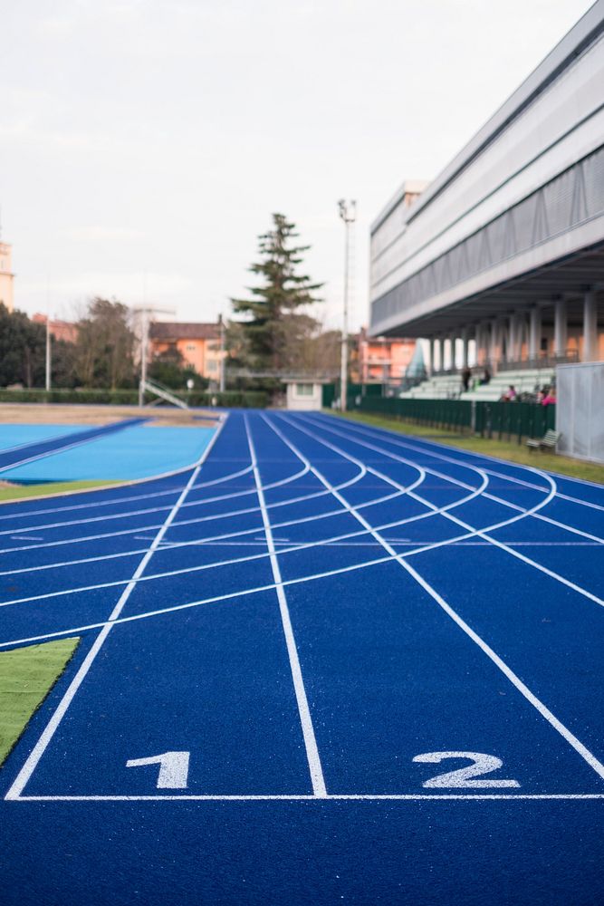 Free close up texture of running track surface with numbers photo, public domain sport CC0 image.