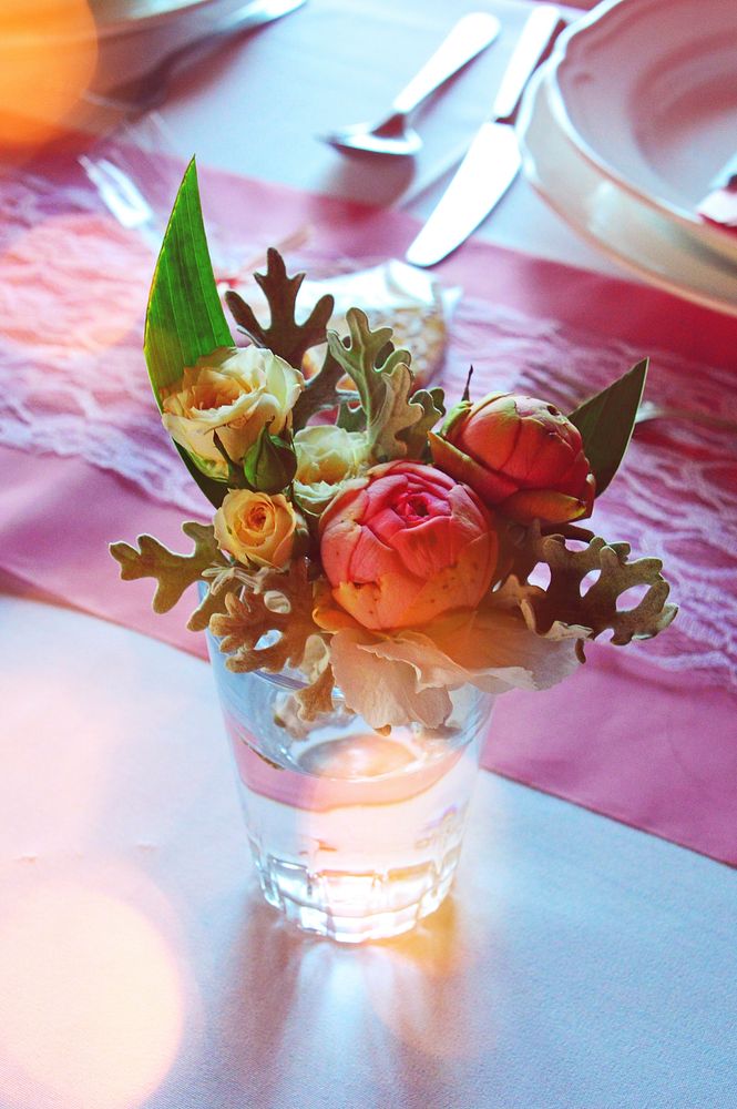 Free bouquet in glass vase on dining table image, public domain flower CC0 photo.