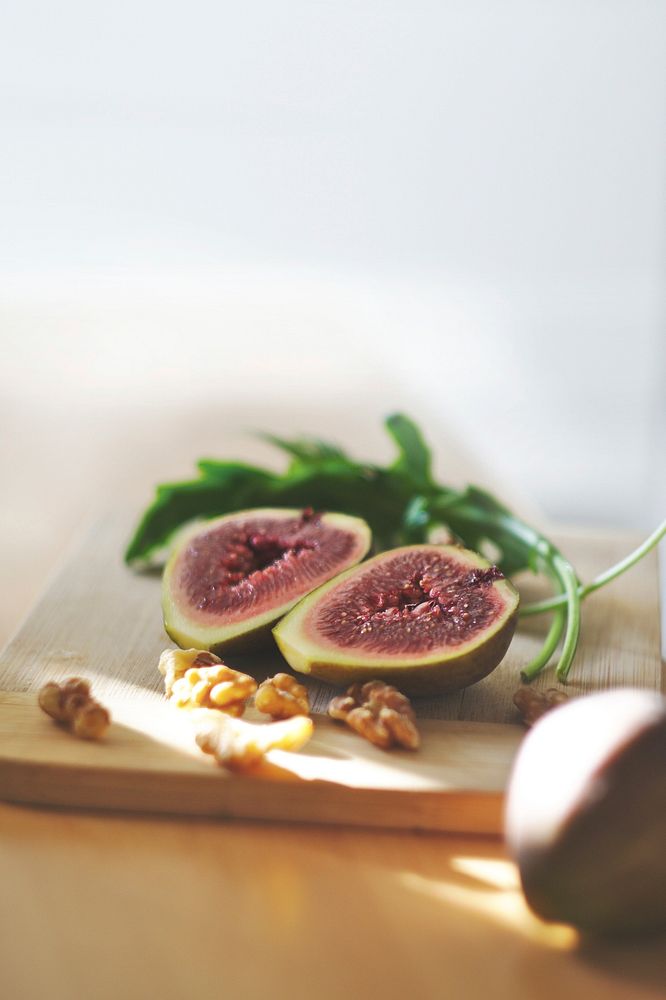 Free sliced fresh fig on cutting board photo, public domain food CC0 image.