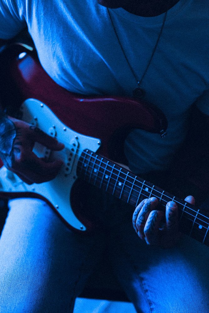 Musician playing guitar, neon blue aesthetic HD photo