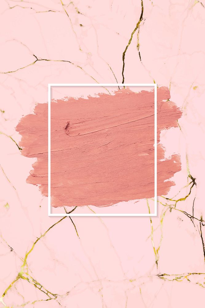 Matte orange paint with a white rectangle frame on a pink marble background
