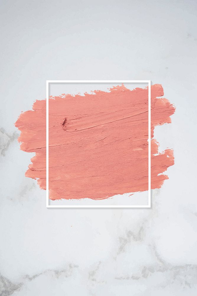 Matte orange paint with a white rectangle frame on a white marble background