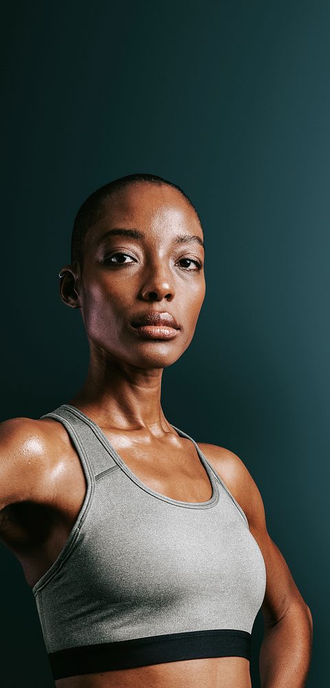 Confidence black woman in gray sportswear