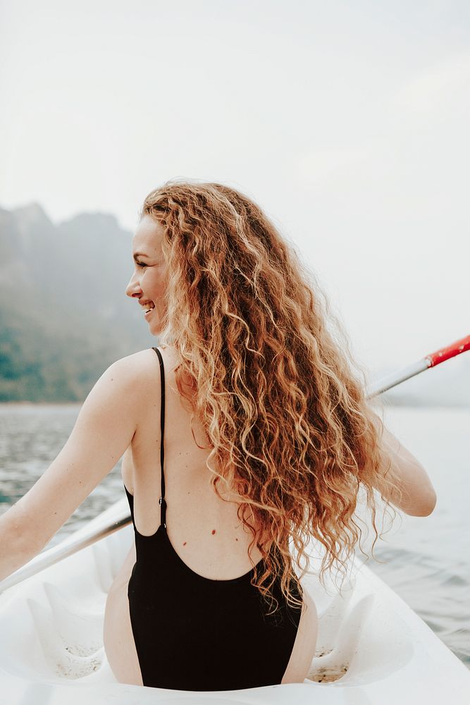 Woman enjoy canoeing, summer vacation