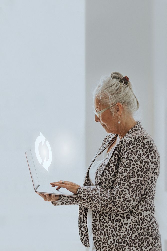 Senior businesswoman using a laptop mockup