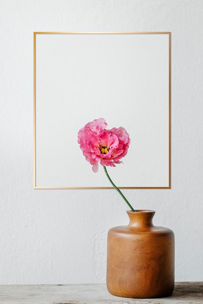 Golden frame on a white wall