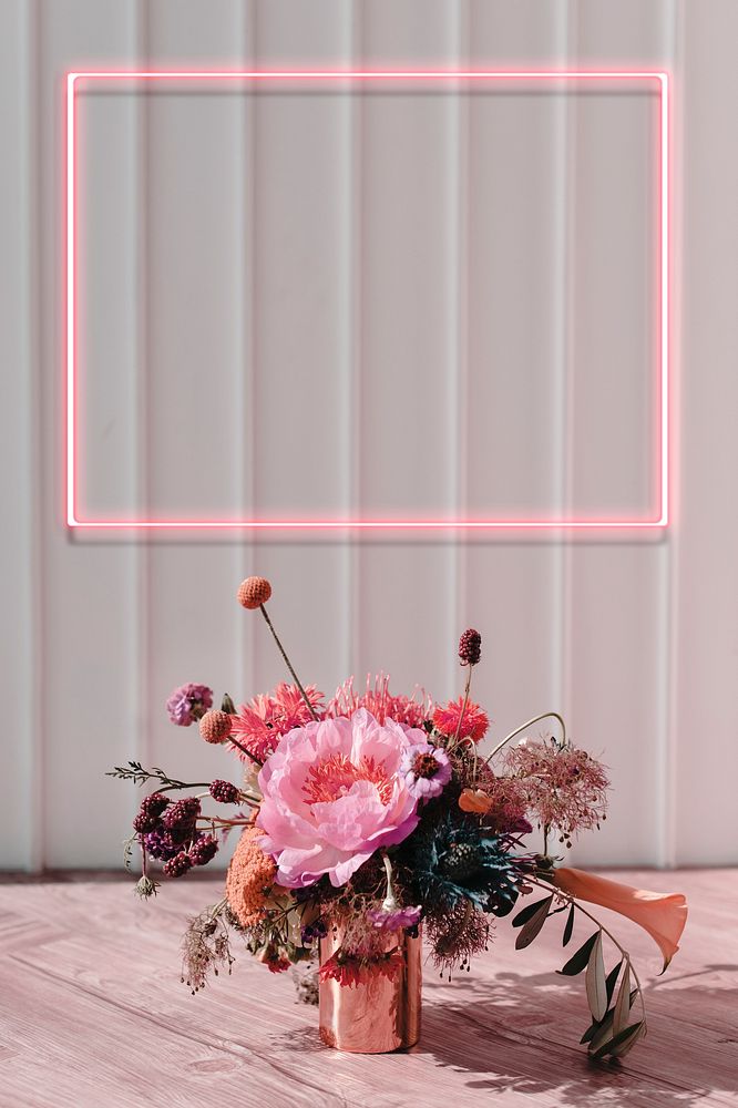 Red floral neon frame on white wall