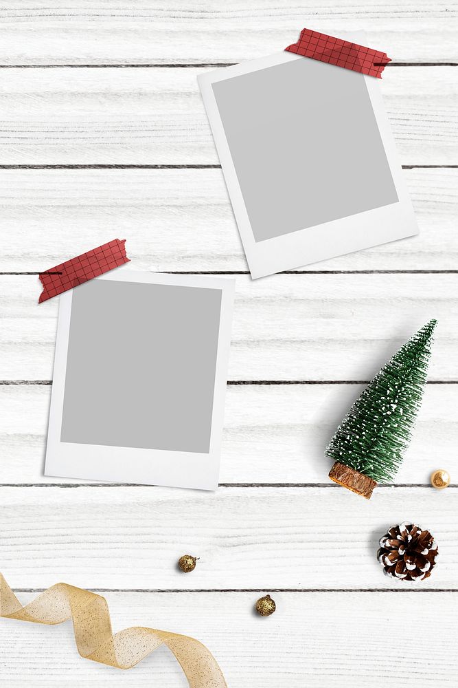 Blank photo frames mockup with Christmas decorations on white wooden background