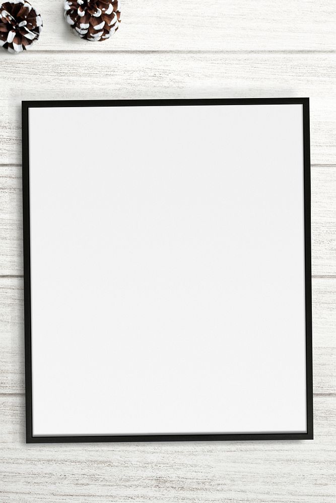 Frame mockup with Christmas decorations on white wooden background