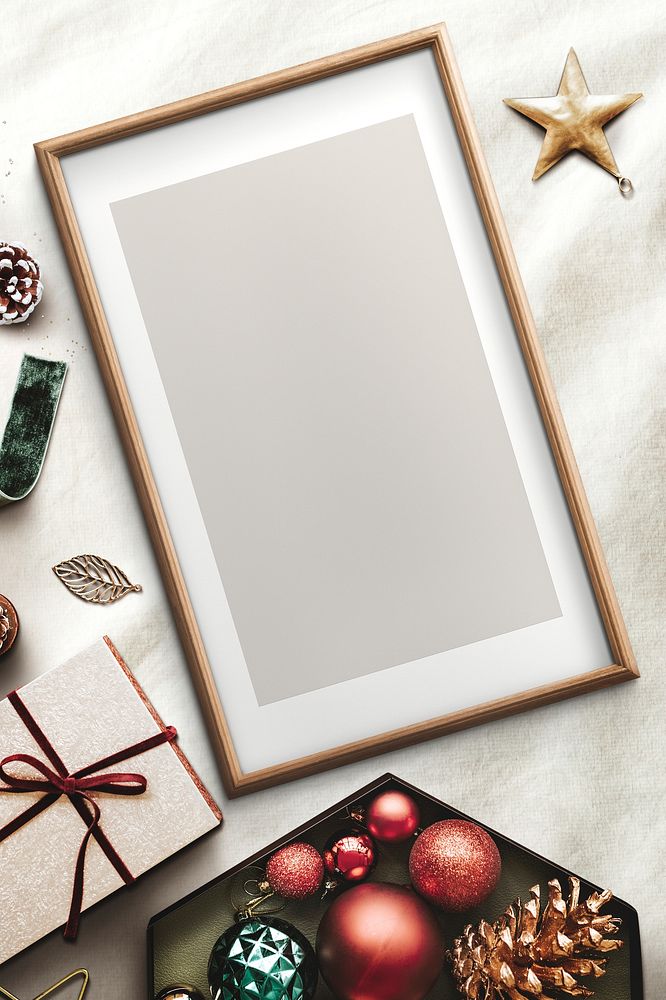 Classic gold frame mockup with Christmas decorations on silver background