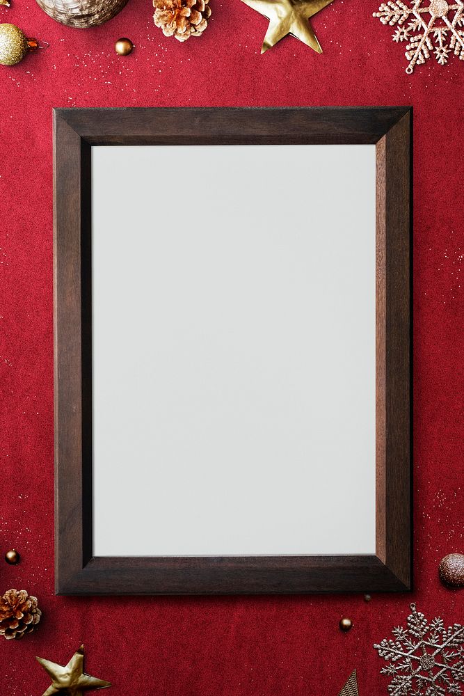Wooden frame mockup with Christmas decorations on red background