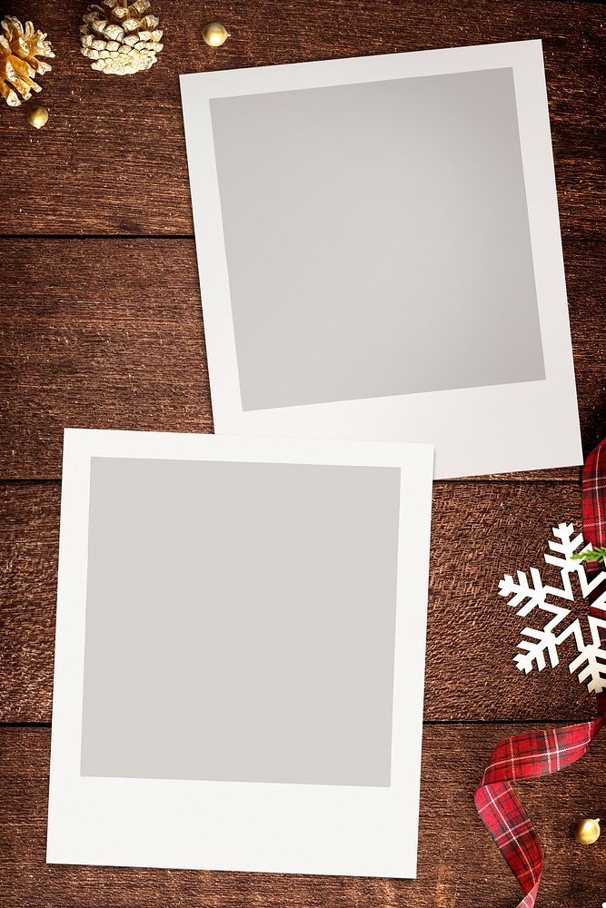 Blank photo frames mockup with Christmas decorations on wooden background