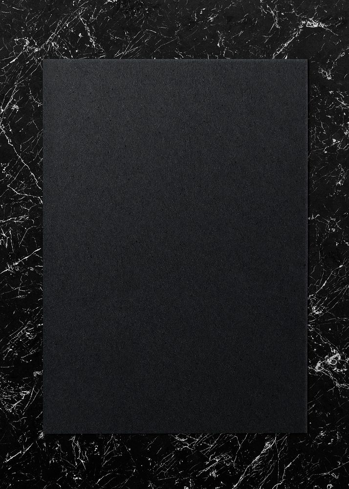 Black paper on a marble background
