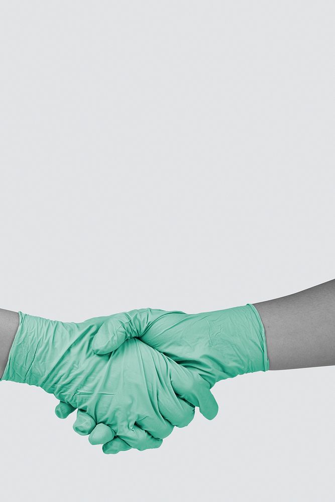 Shaking hands with latex gloves on to prevent coronavirus contamination