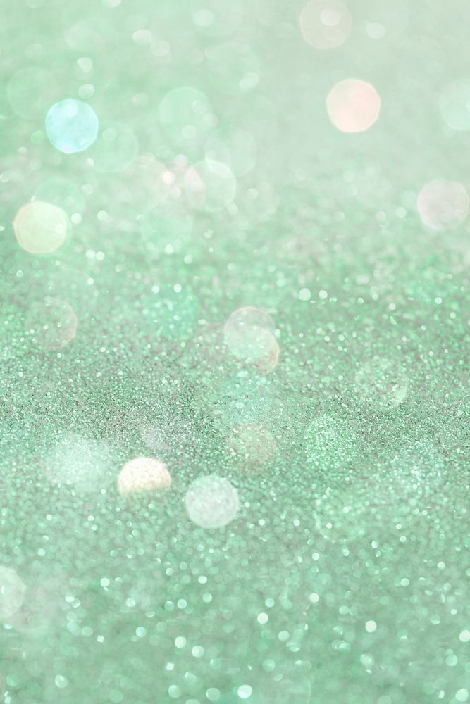 Glittery bokeh pattern on a green background