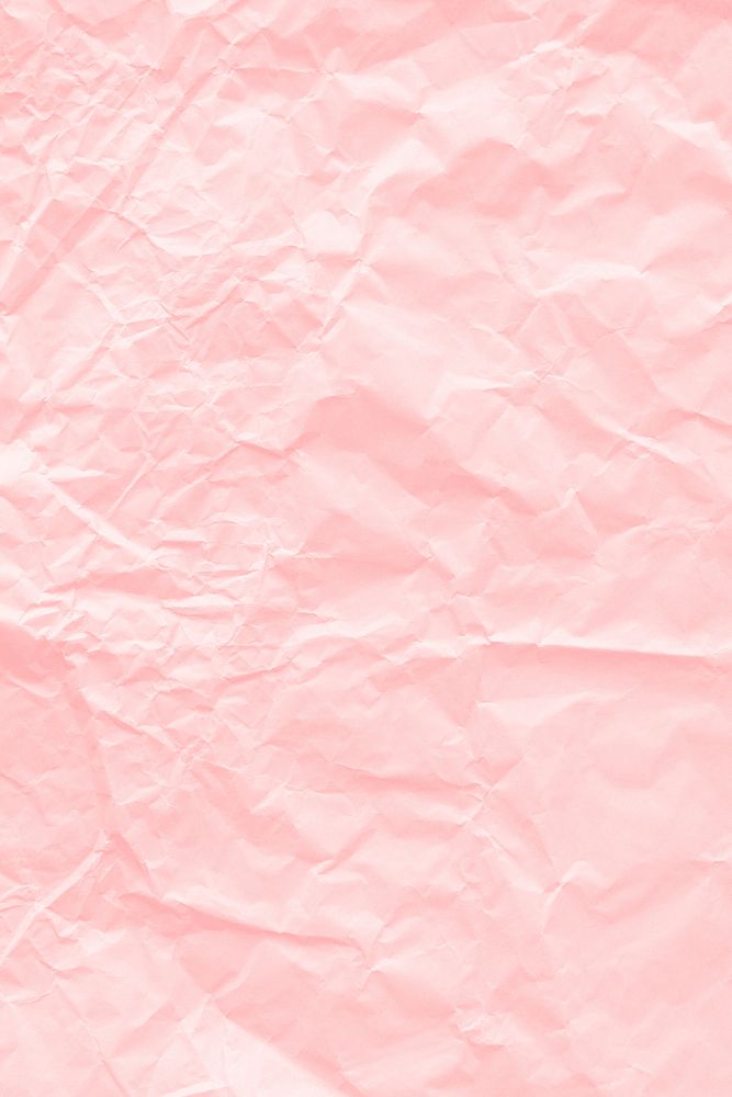 Crumpled salmon pink paper textured background