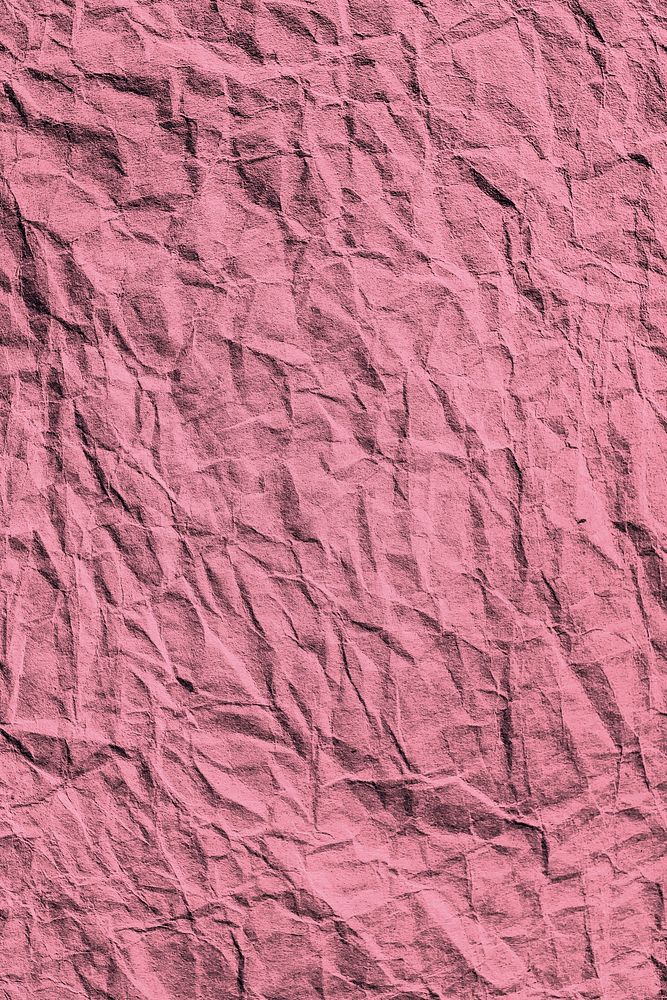 Crumpled rouge pink paper textured background