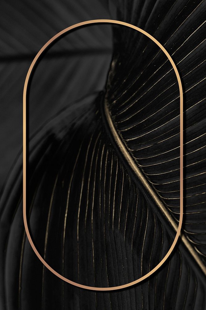 Golden oval frame on a bird of paradise leaf background