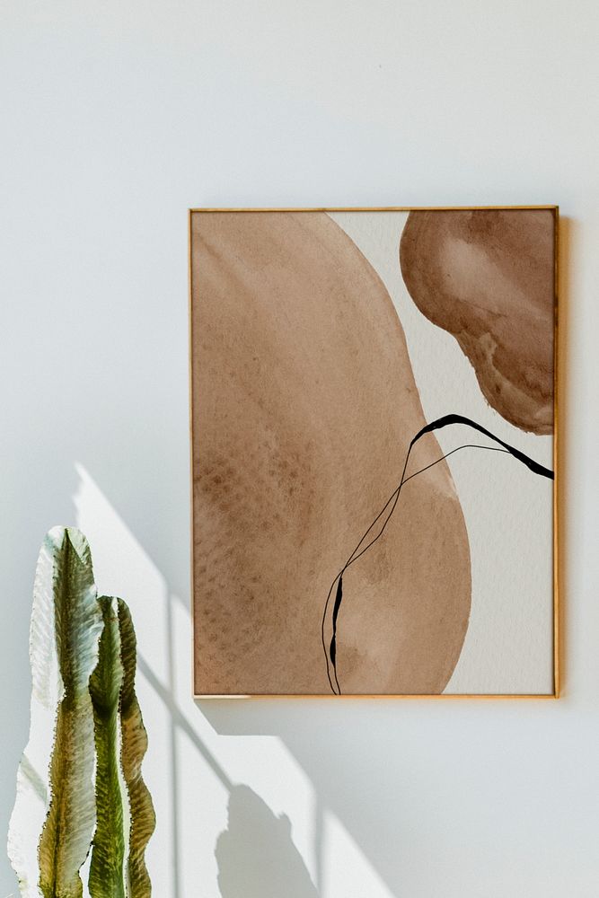 Watercolor artwork mockup hanging on a white wall