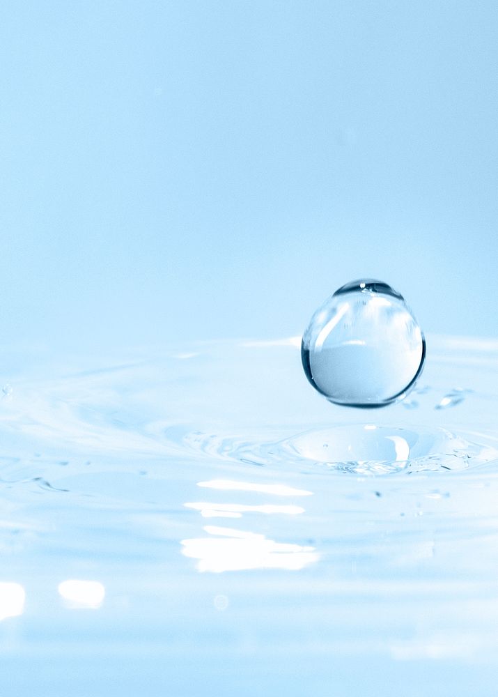 Clear water drop on water blue background