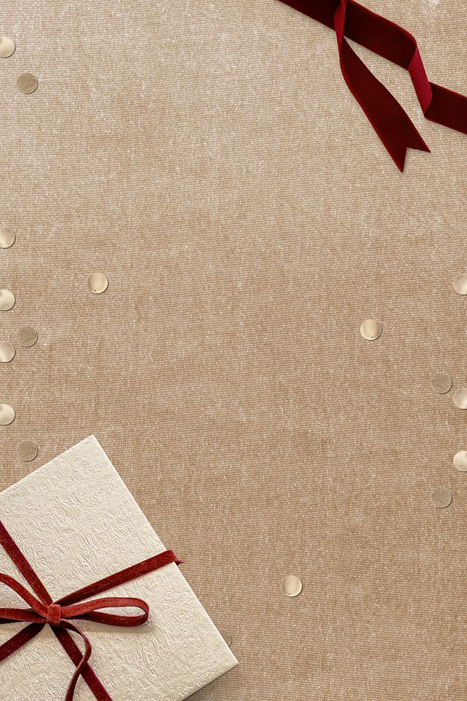 Christmas gift psd with confetti on beige background
