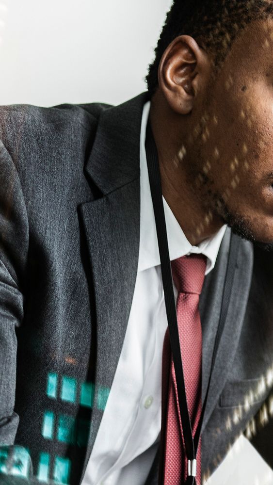 Stressed black businessman with city background