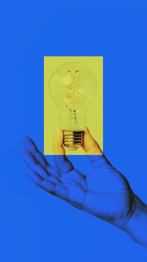 Hand holding light bulb idea on blue background