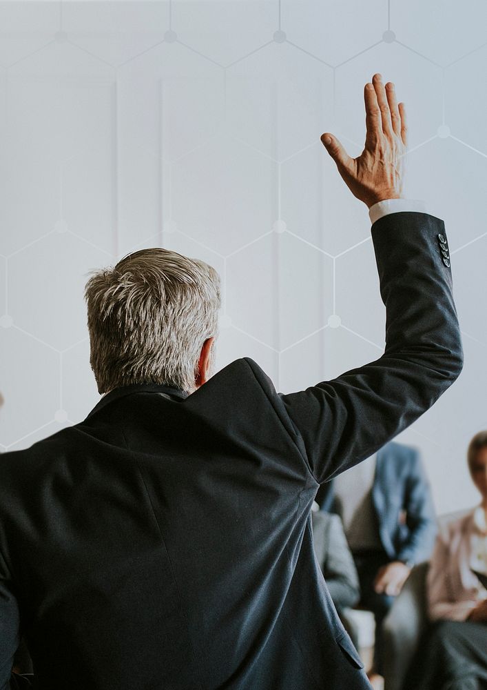 Businessman raising hand in a meeting background