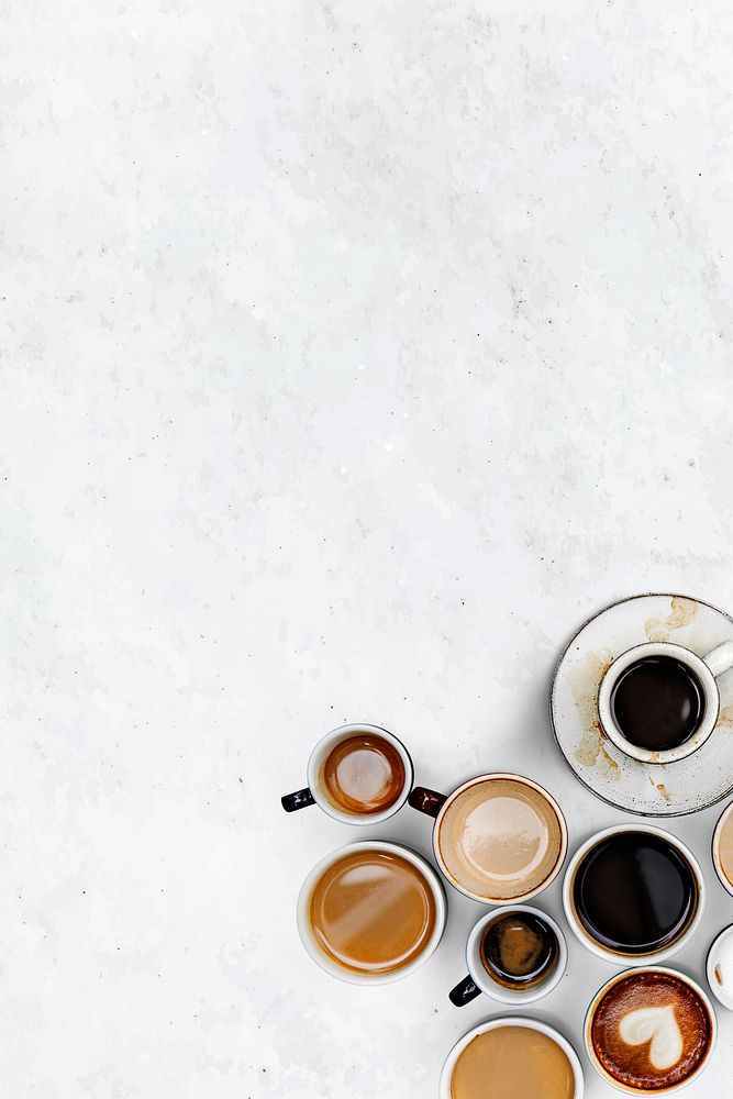 Coffee cups on a white marble textured wallpaper