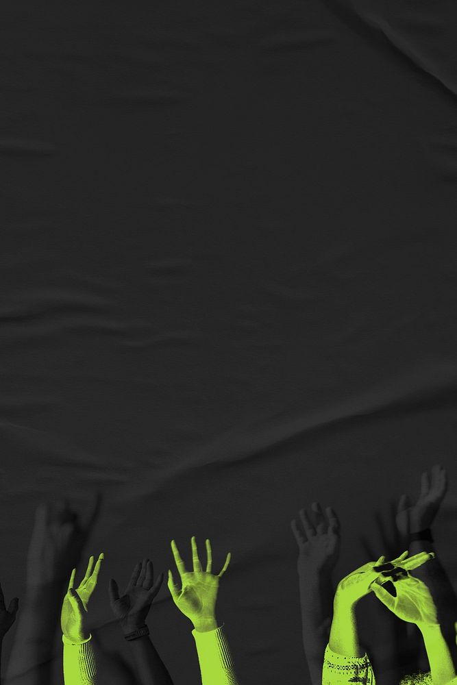 Green arms raising on black paper textured background