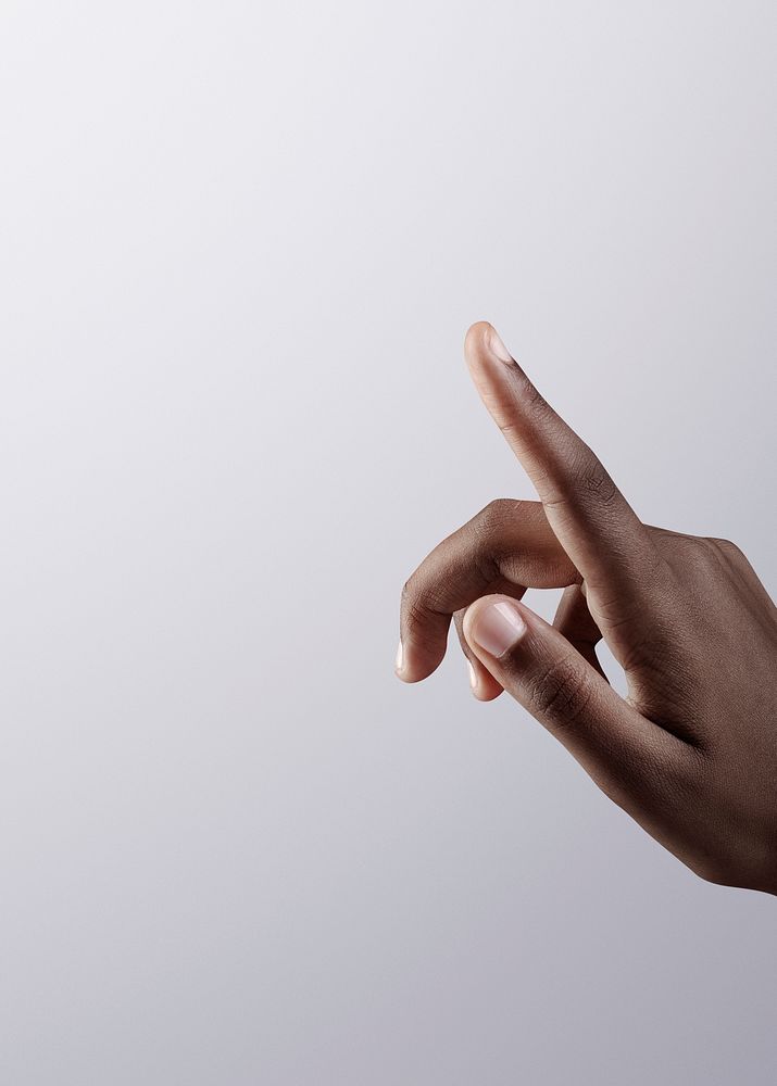 Woman&rsquo;s finger pointing on gray border background