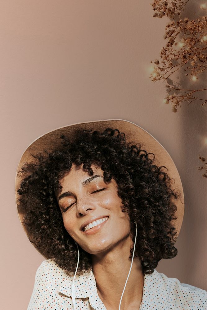 Woman with curly hair wearing earphones with leaf border remixed media