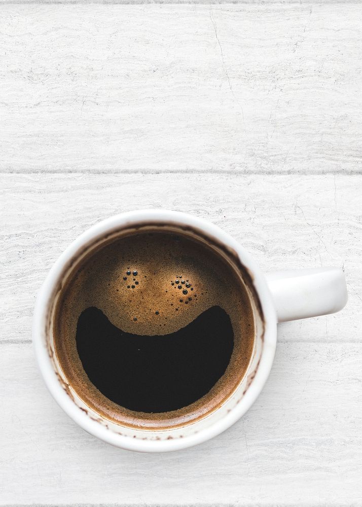 Aesthetic Americano coffee cup psd on a white wooden table