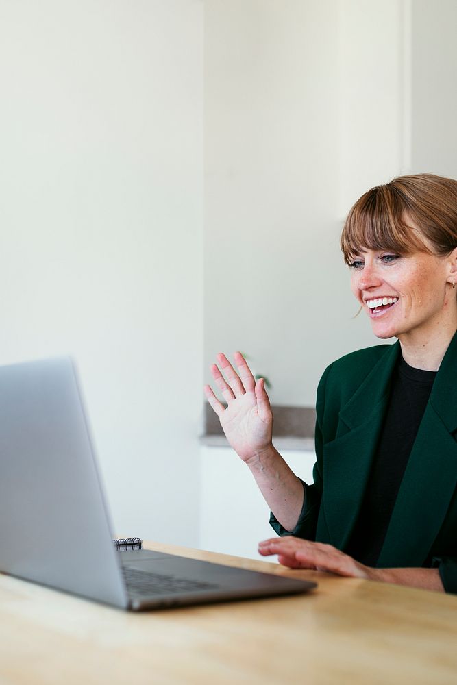 Businesswoman having a video conference with colleagues during coronavirus quarantine