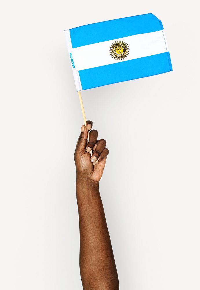 Hand holding flag isolated