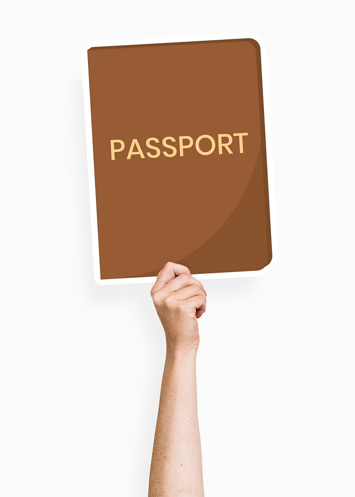 Hand holding a passport cardboard prop