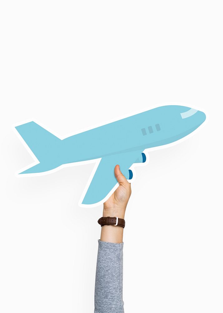 Hand holding an airplane cardboard prop