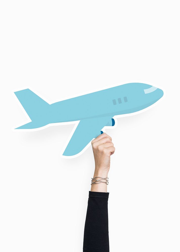 Hand holding an airplane cardboard prop