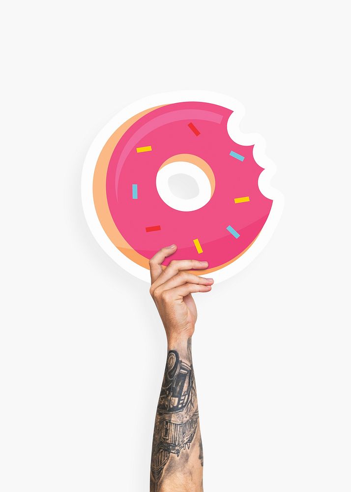 Hand holding a donut cardboard prop