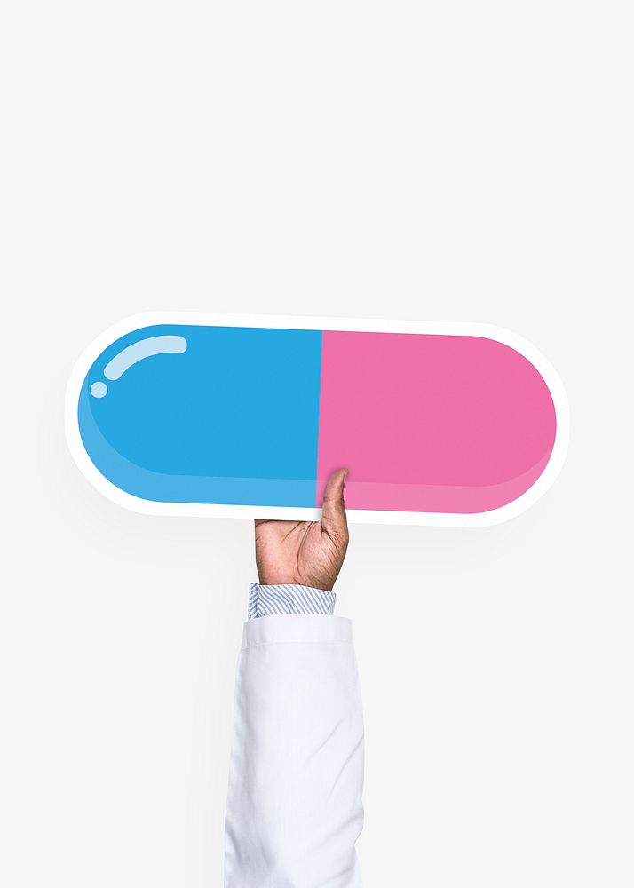Hand holding a pill cardboard prop