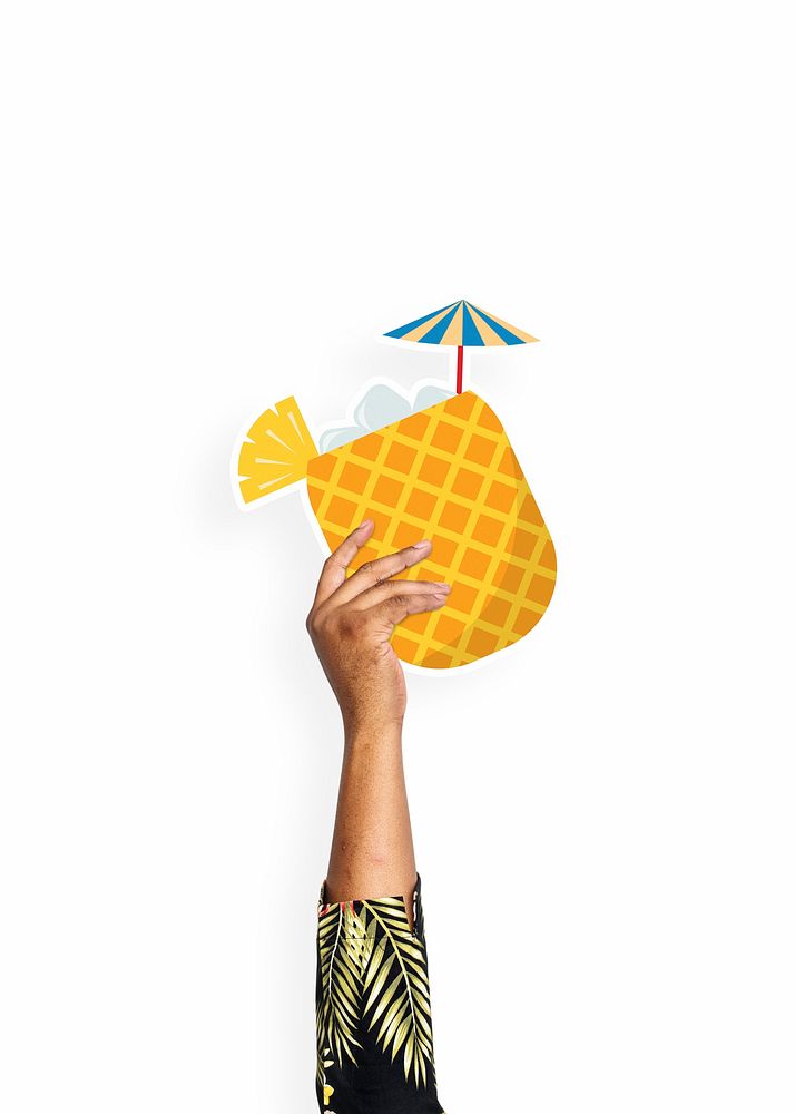 Hand holding a pineapple drink cardboard prop