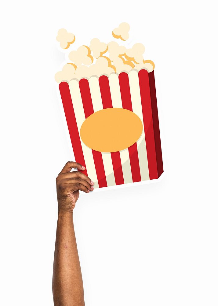 Hand holding a popcorn cardboard prop