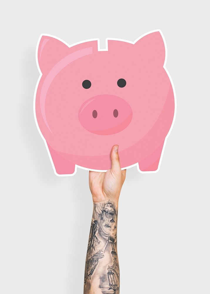 Hand holding a piggy bank cardboard prop