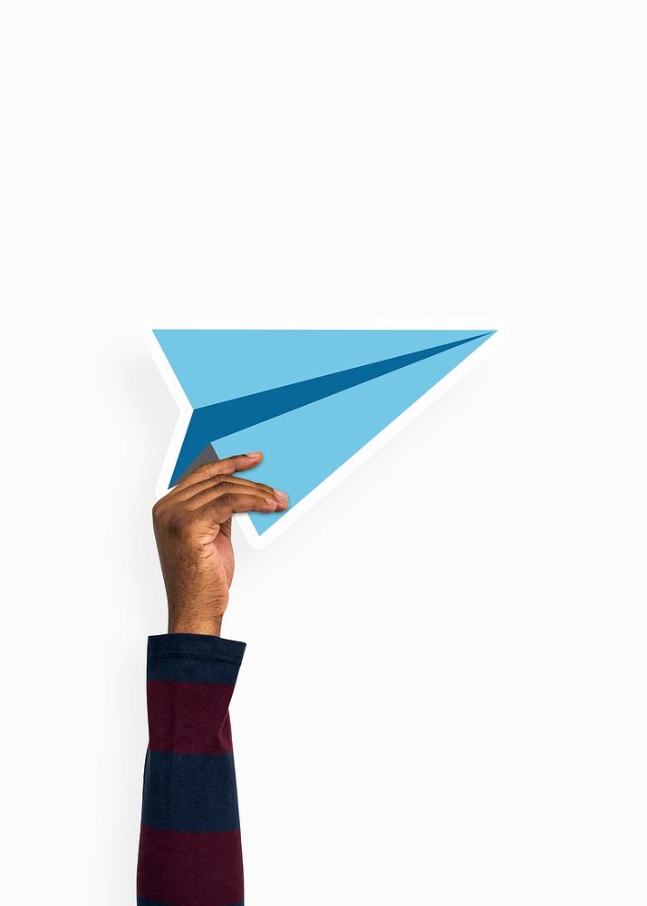 Hand holding a paper plane