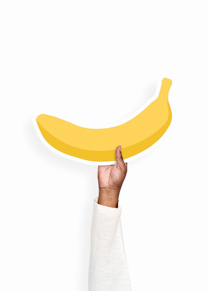 Hand holding a banana cardboard prop