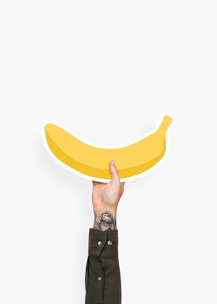 Hand holding a banana cardboard prop