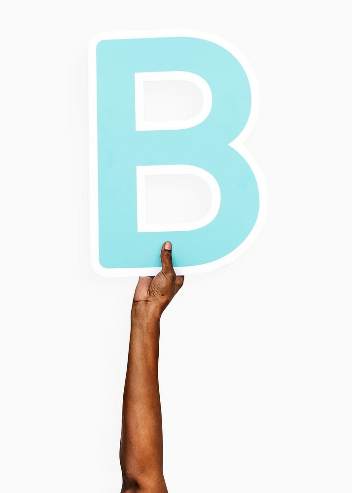 Hands holding the letter B